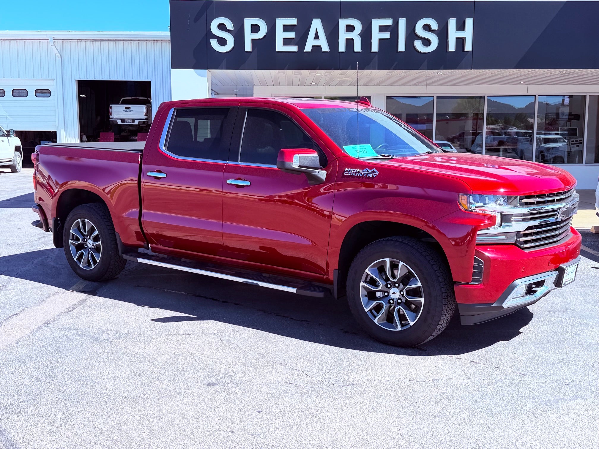 2021 Chevrolet Silverado 1500 Crew Cab Short Box 4-Wheel Drive High Country in Cherry Red Tintcoat — front three-quarter view