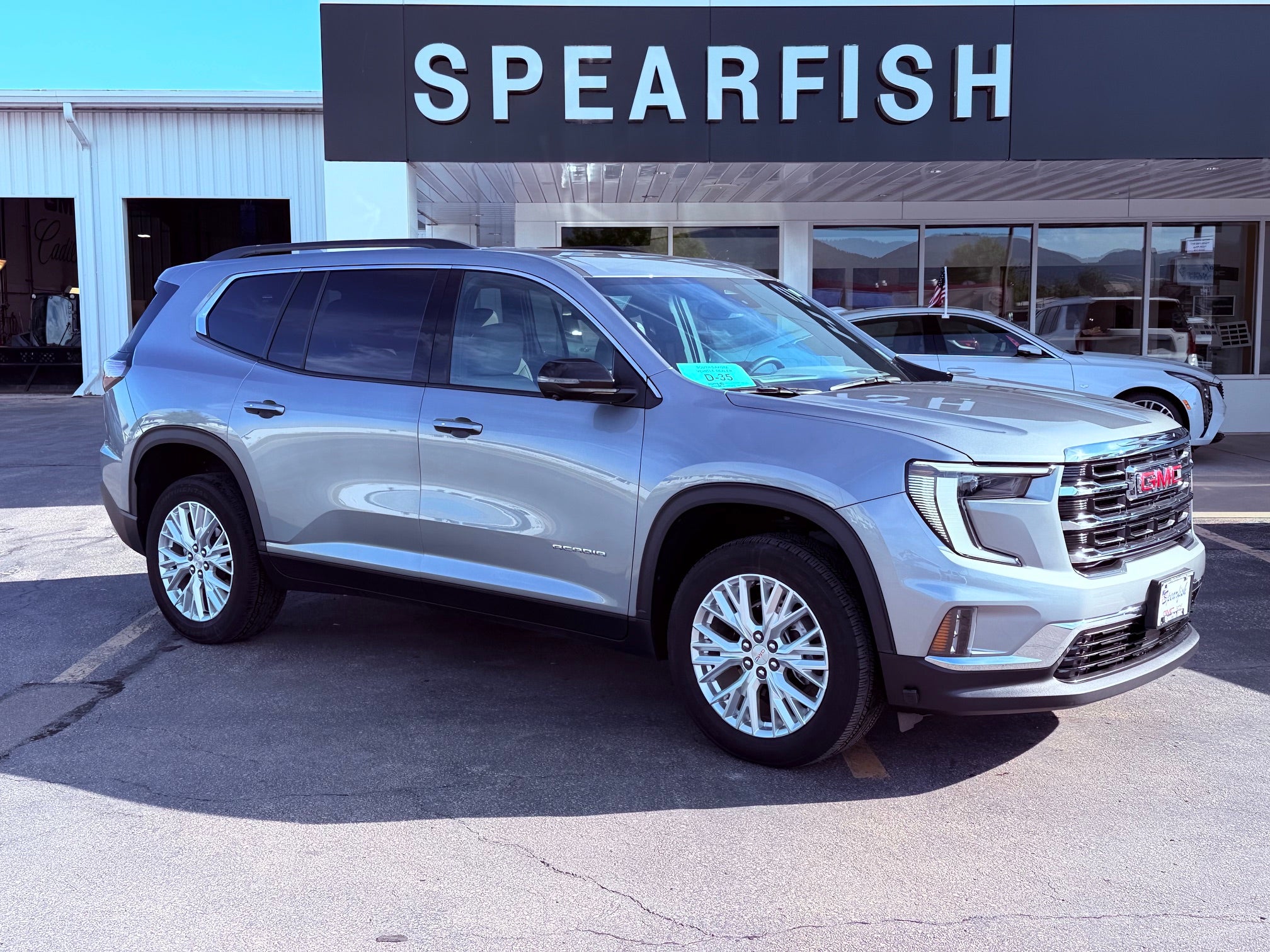 2024 GMC Acadia Elevation in Sterling Metallic — front three-quarter view
