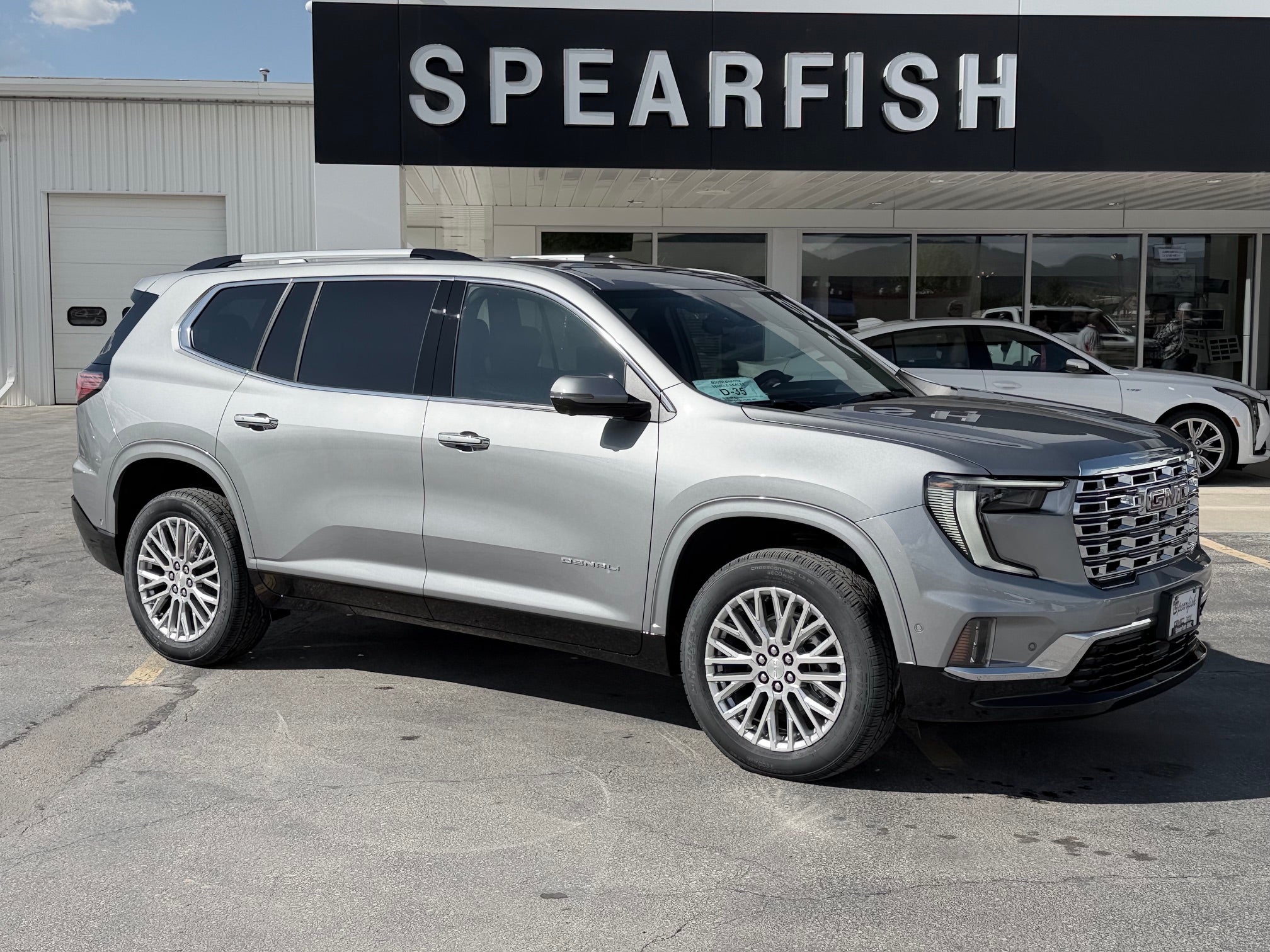 2026 GMC Acadia Denali in Sterling Metallic — front three-quarter view