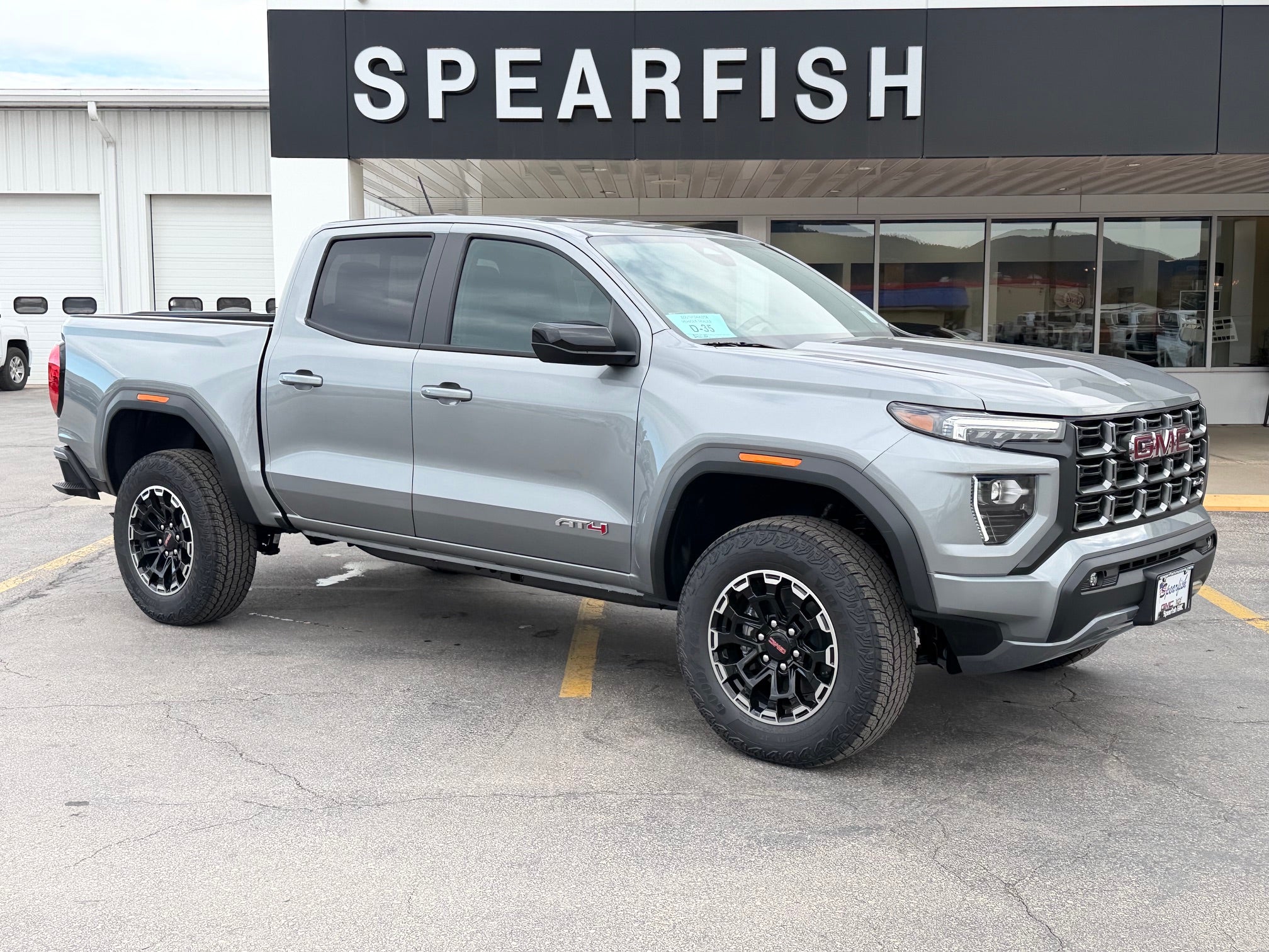2026 GMC Canyon AT4 in Sterling Metallic — front three-quarter view