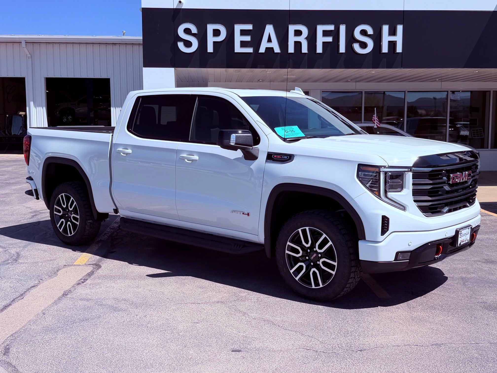 2026 GMC Sierra 1500 AT4 in Summit White — front three-quarter view