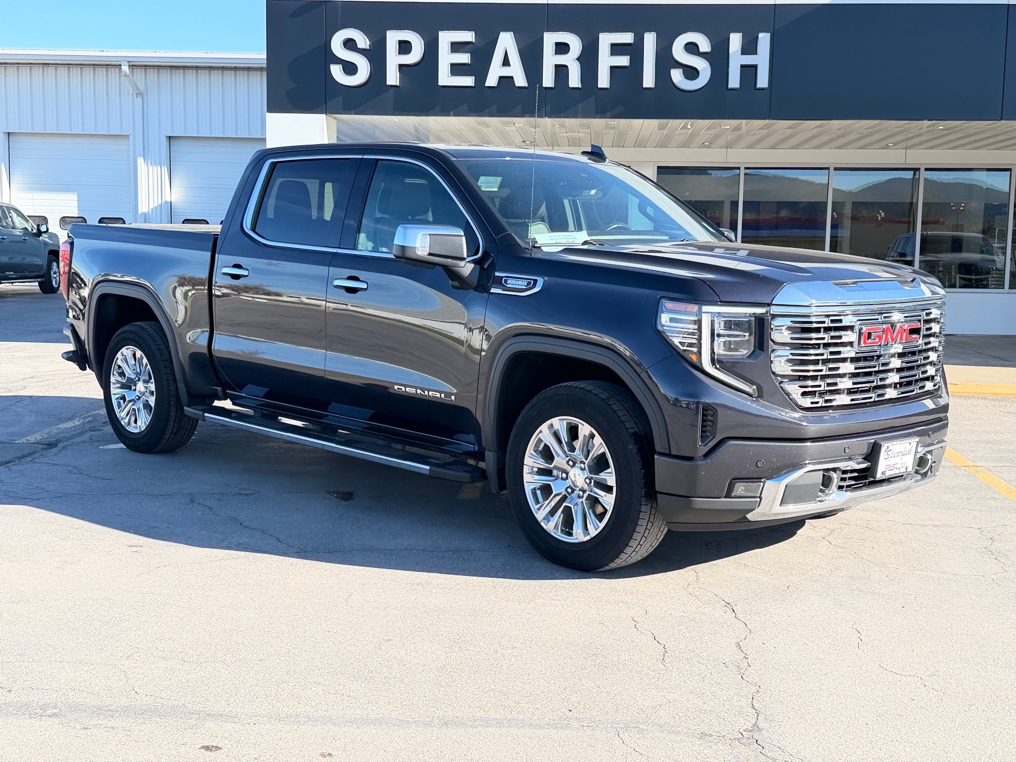 2023 GMC Sierra 1500 Denali in Titanium Rush Metallic — front three-quarter view