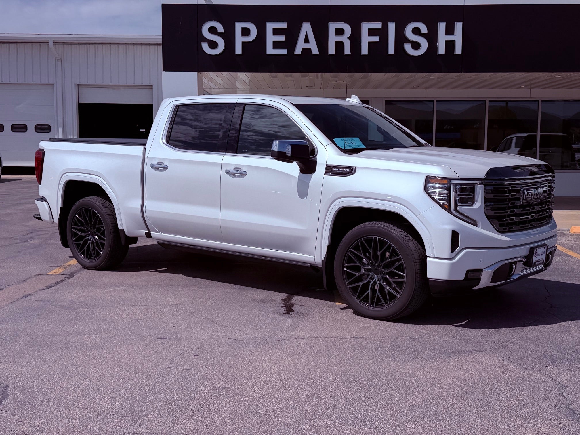 2024 GMC Sierra 1500 Crew Cab Short Box 4-Wheel Drive Denali Ultimate in White Frost Tricoat — front three-quarter view