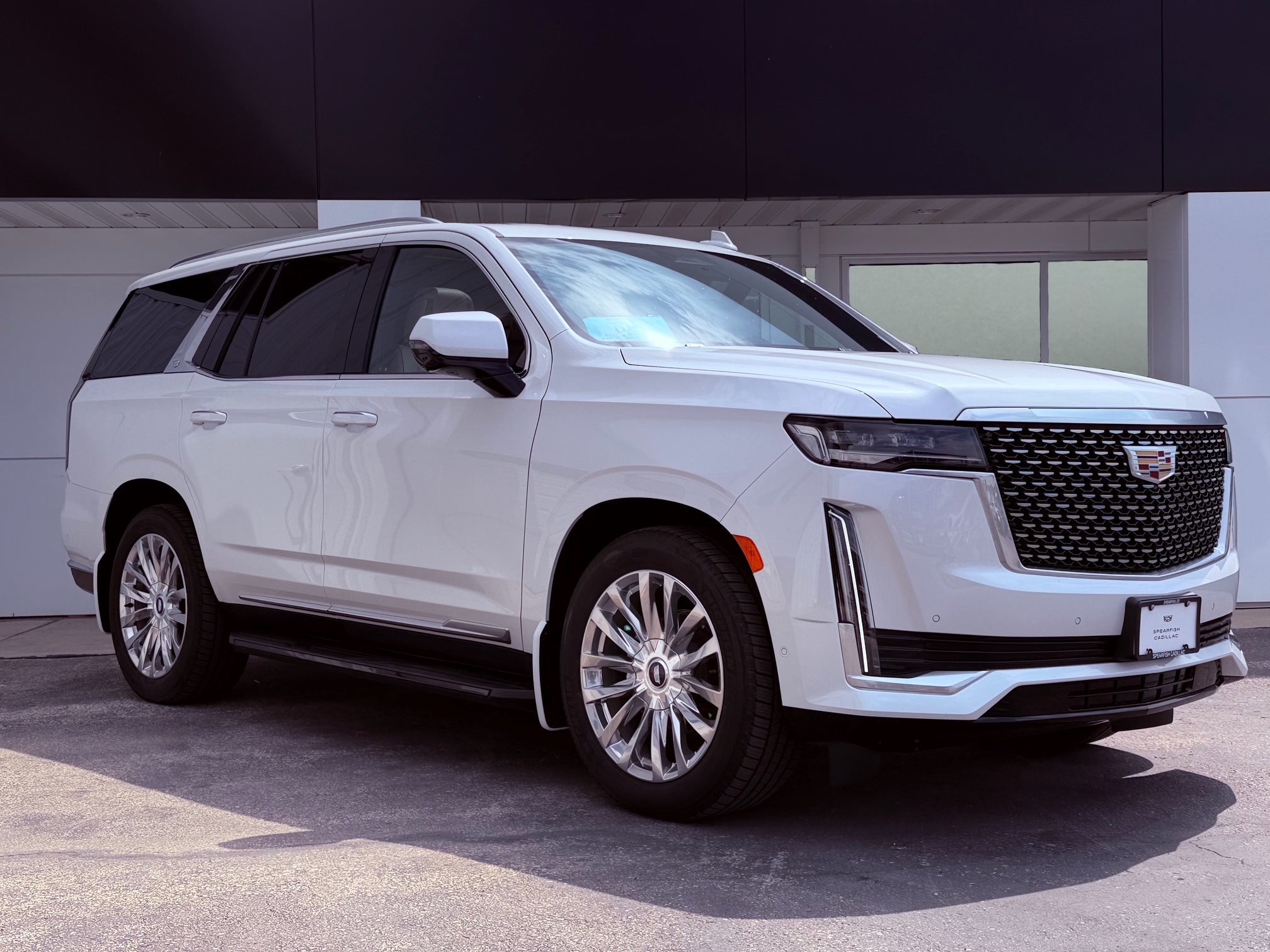 2021 Cadillac Escalade Premium Luxury in Crystal White Tricoat — front three-quarter view