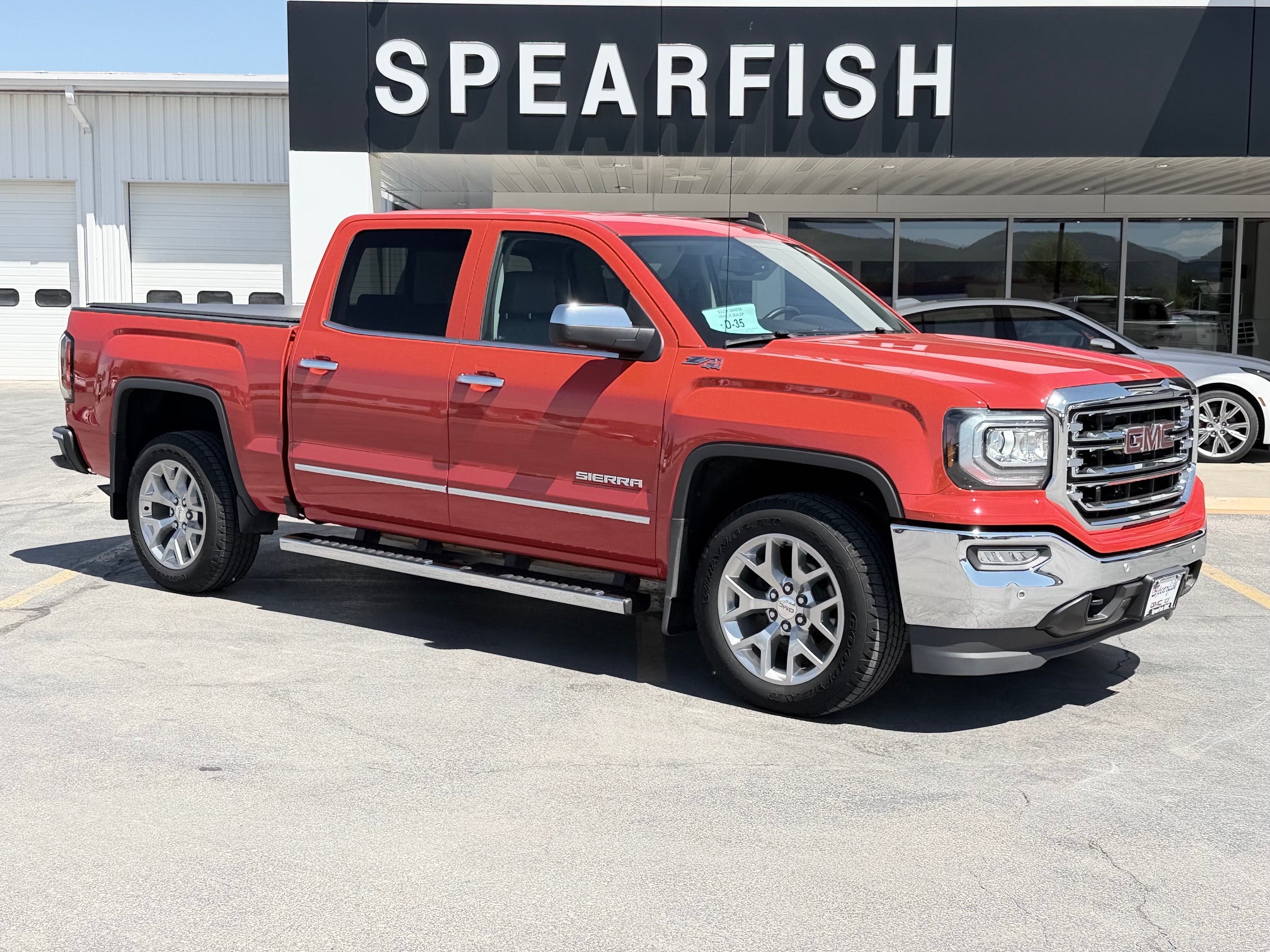 2018 GMC Sierra 1500 SLT in Cardinal Red — front three-quarter view