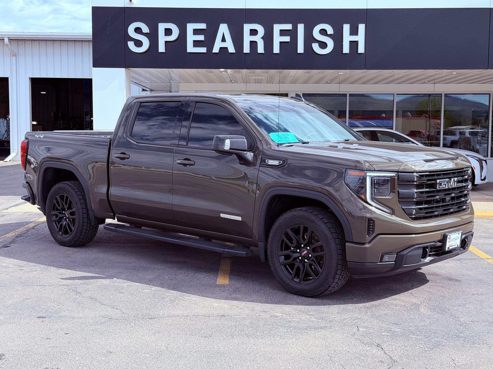 2023 GMC Sierra 1500 Elevation in Deep Bronze Metallic — front three-quarter view