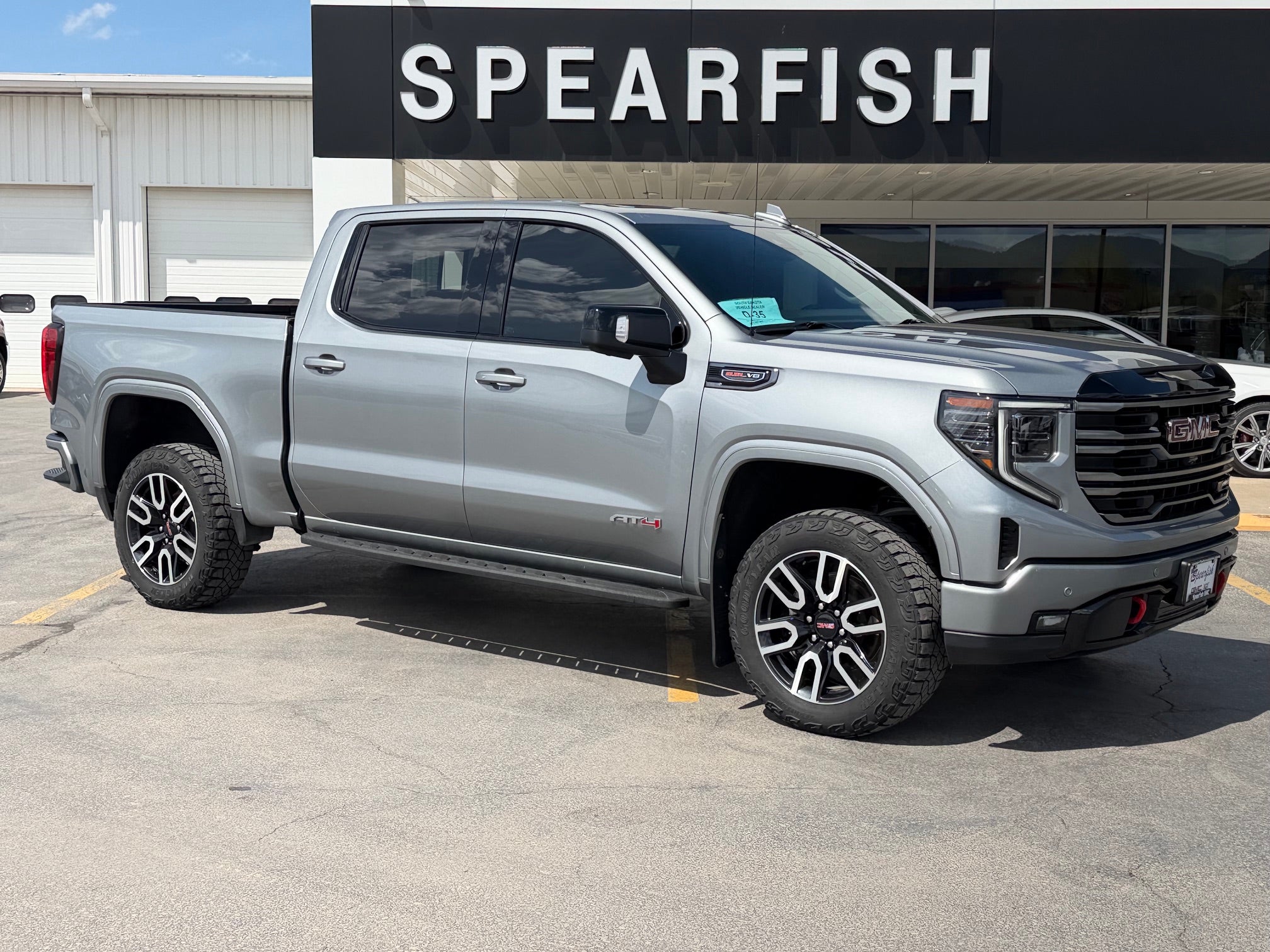 2025 GMC Sierra 1500 AT4 in Sterling Metallic — front three-quarter view