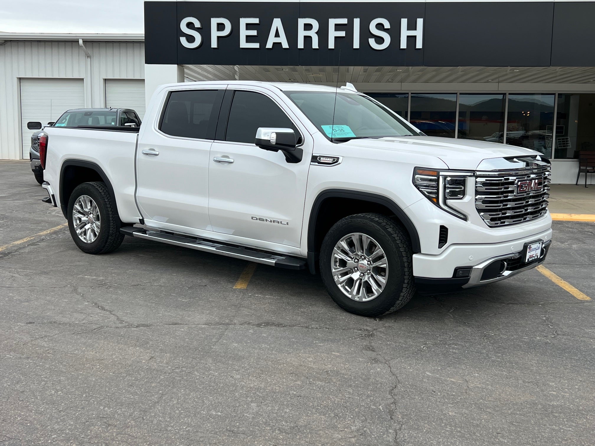 2023 GMC Sierra 1500 Denali in White Frost Tricoat — front three-quarter view